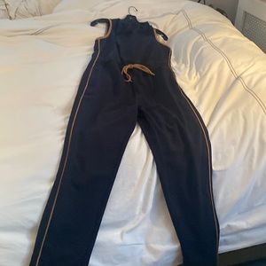 Worn once, excellent condition navy jumpsuit from Reiss with tan piping
